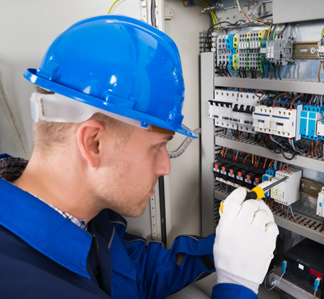 electrician working on electrical panel